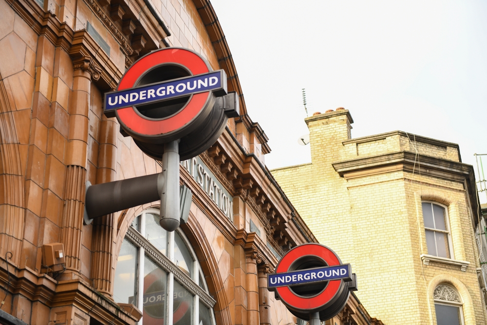 London underground signs on old building in London.