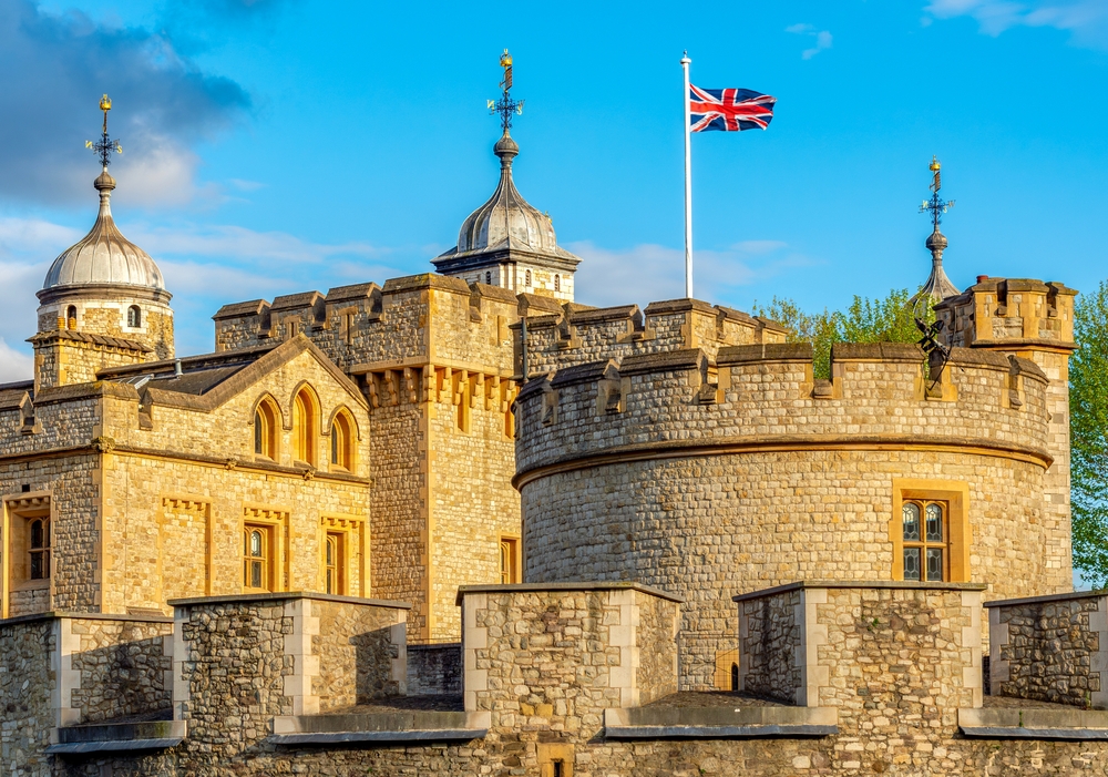 The tower of London showing the castle and the union jack.