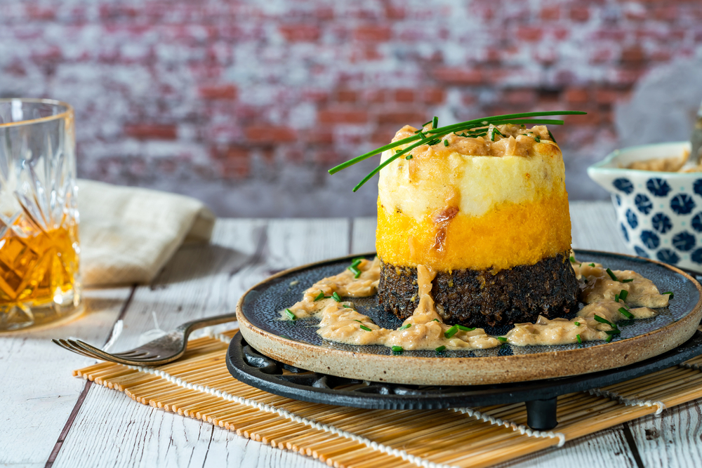 Haggis, neeps and tatties stack (haggis with turnips and potatoes) with whisky sauce