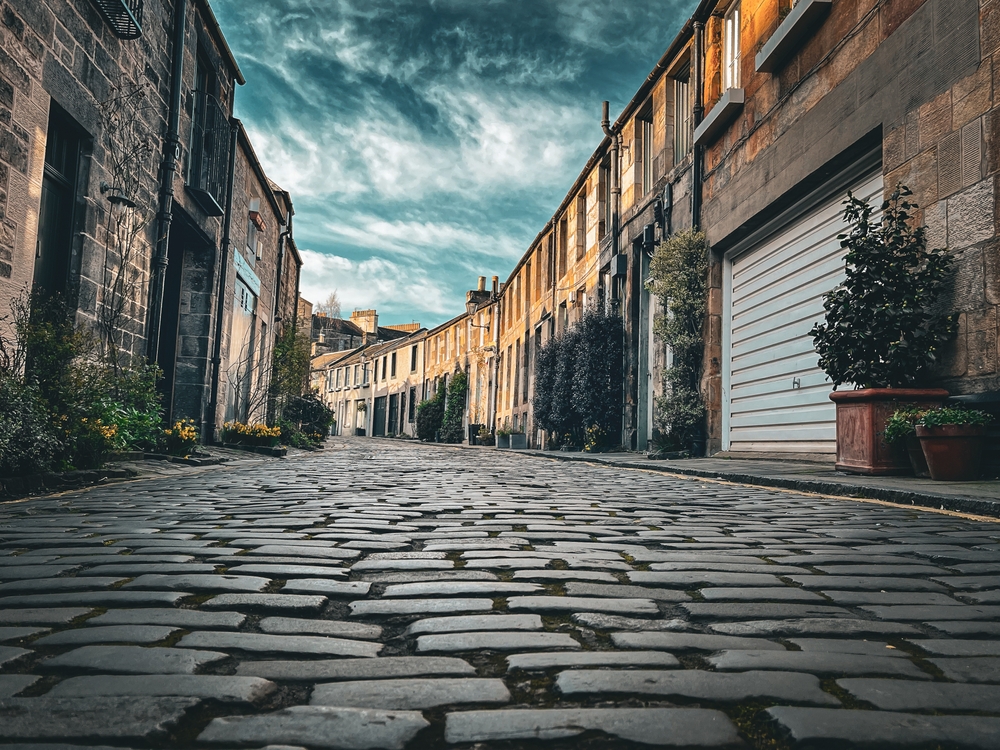 Edinburgh, Circus lane dramatic view with cloudy sky and close up cobblestones street