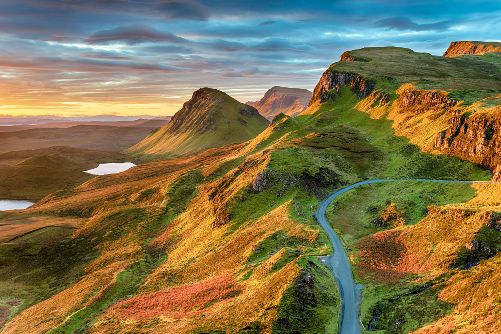 Beautiful sunrise sky over rock formations on the Quiraing, an ancient landslip on the eastern face of Meall na Suiramach on the Ilse of Skye in Scotland