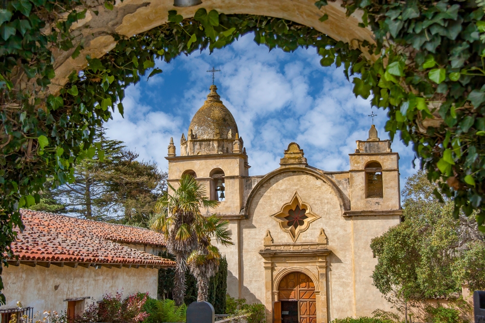 The Spanish Mission inside Carmel by the sea covered archways of ivy