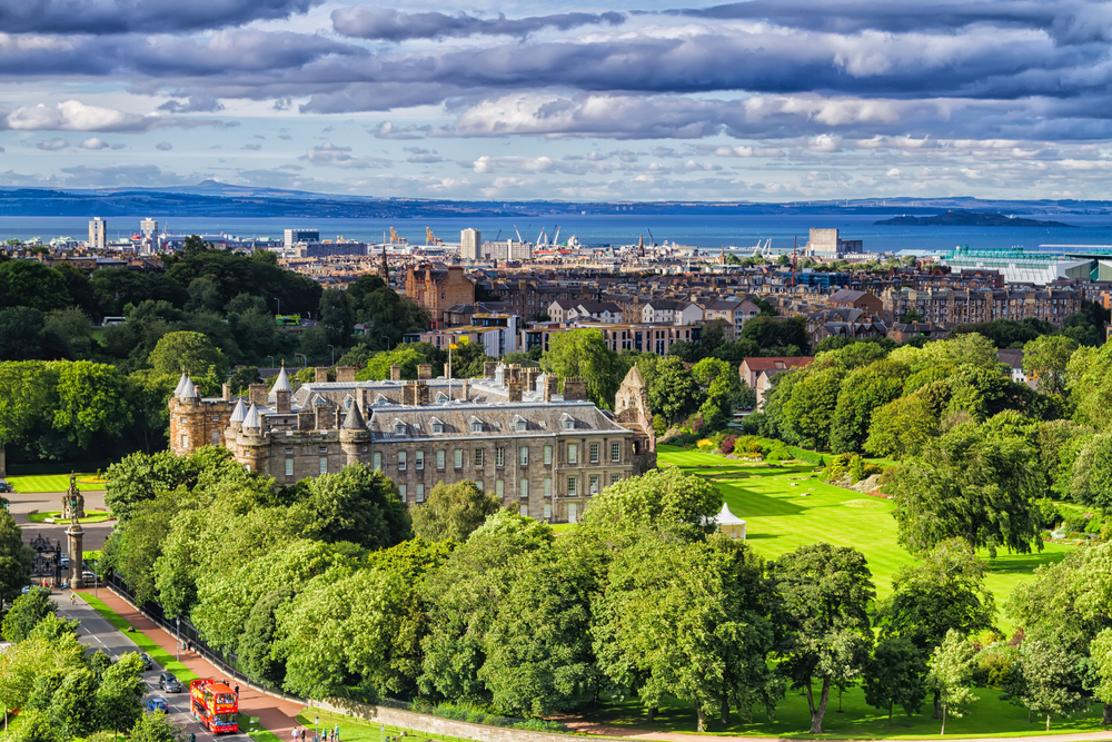 a panoramic view of Edinburgh from the hike at Arthurs seat with the town, and the ocean views