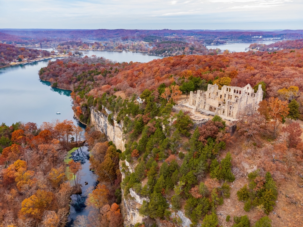 taken during fall time surrounded by fall foliage trees, lake of Ozarks is ha ha tonk ruins