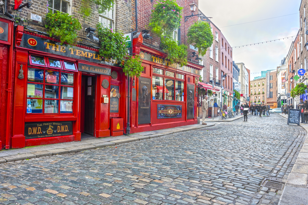 A famous spot in Dublin: the Temple Bar! This pub is colored red and is bright amongst the other stone store fronts and cobblestone streets.