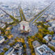 An overhead shot shows the famous roundabout and arc in Paris as cars circle around it: knowing how to navigate things like this can come from a guide book, which is one of the many things to buy from Amazon for Paris.