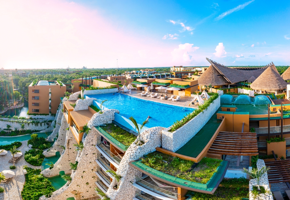 A beautiful staggered all-inclusive has multiple stories, a rooftop pool, cabanas, rivers and more.