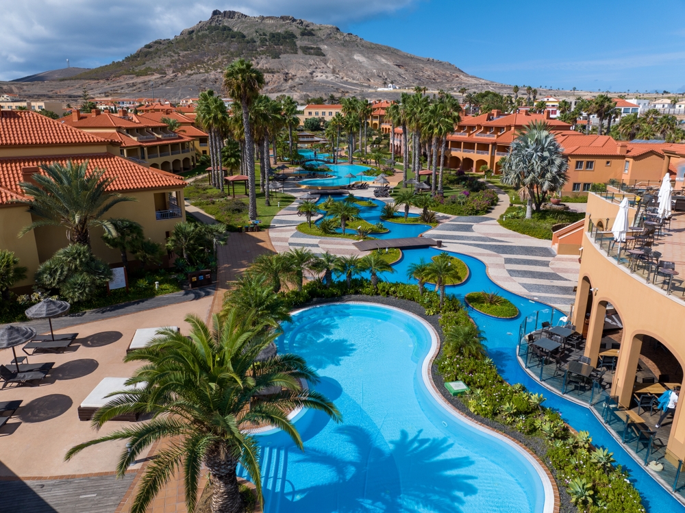 Knowing what things to buy from Amazon for an all-inclusive resort can have you enjoy places like this with lazy rivers, private cabanas, and stunning mountain views in the back!
