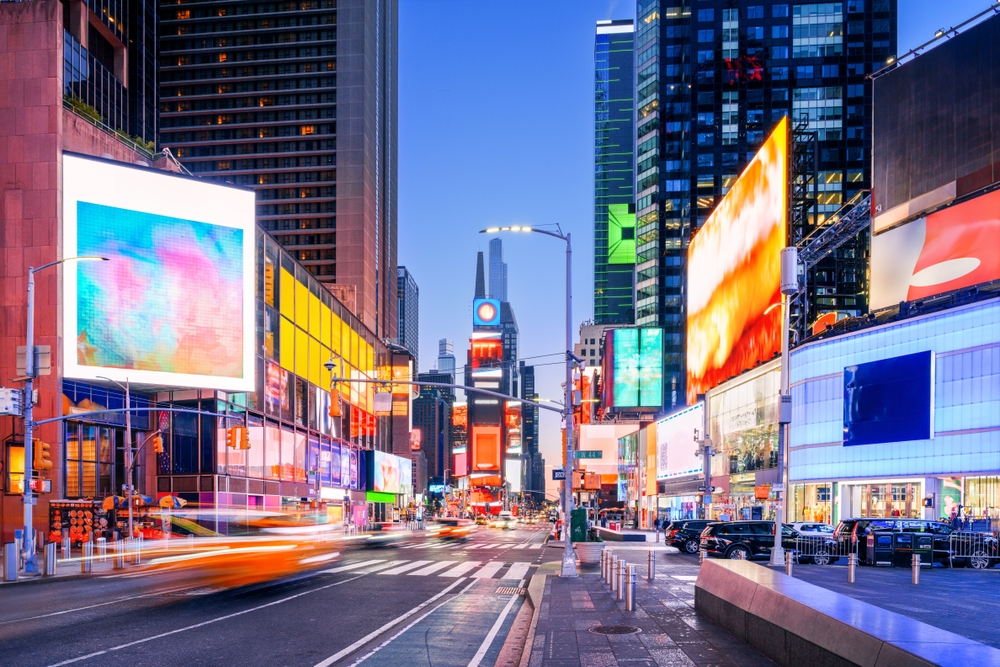 Midtown Manhattan at blue hour. showing all the lights. Article is about things to buy from Amazon for NYC.