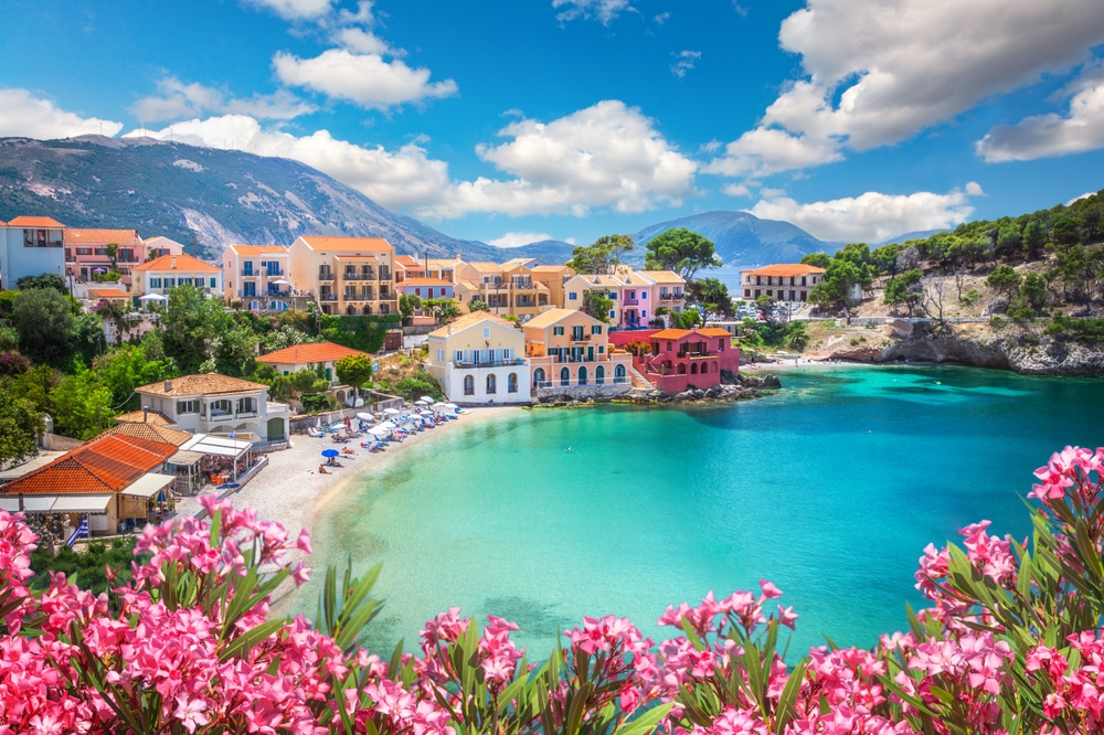 Assos village in Kefalonia, Greece. You can see the sea, flowers and houses.