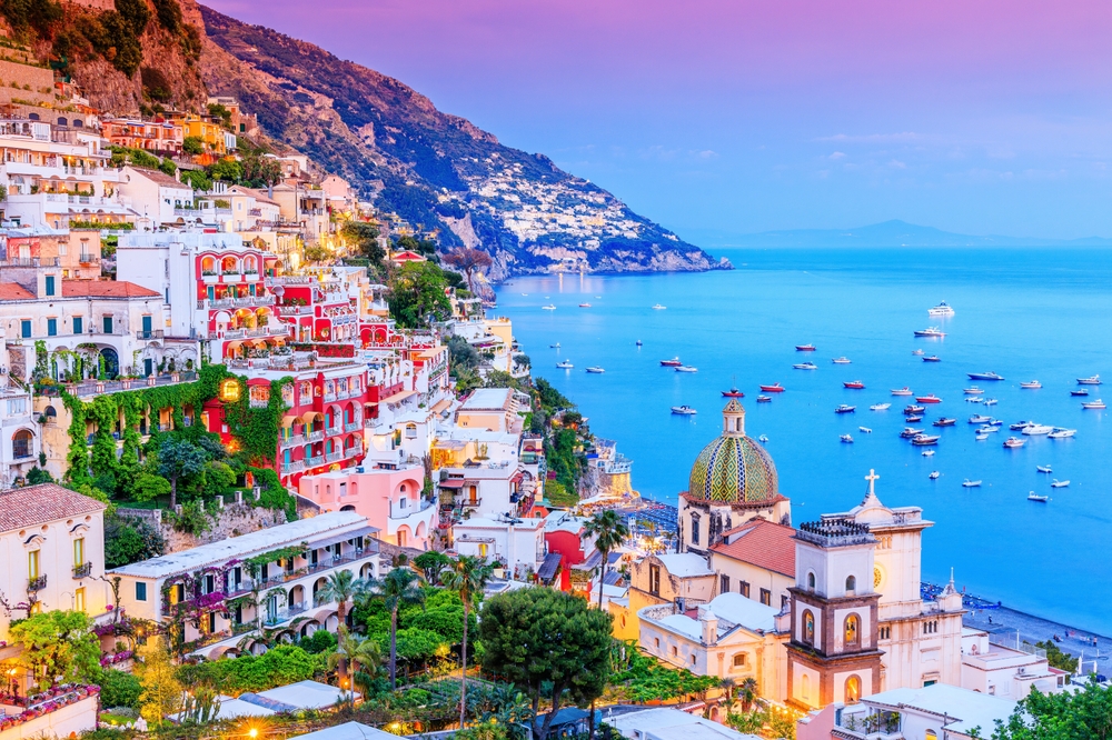 Amalfi Coast, Italy. View of Positano town and the seaside. The article is about fairytale destinations.