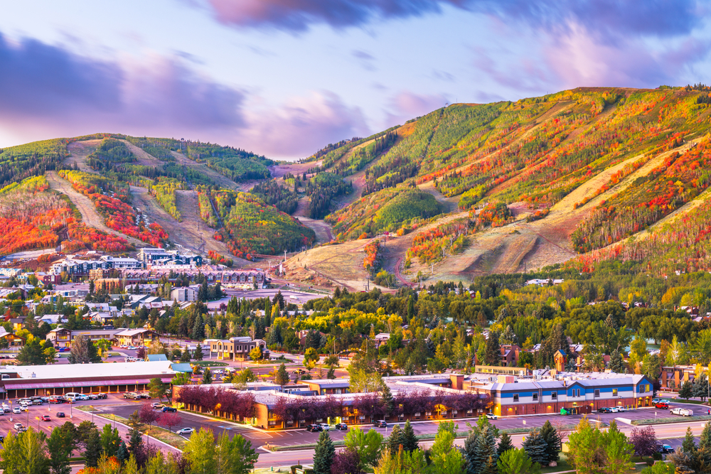 Park City, Utah, USA downtown in autumn at dusk. The article is about fall foliage weekend getaways.