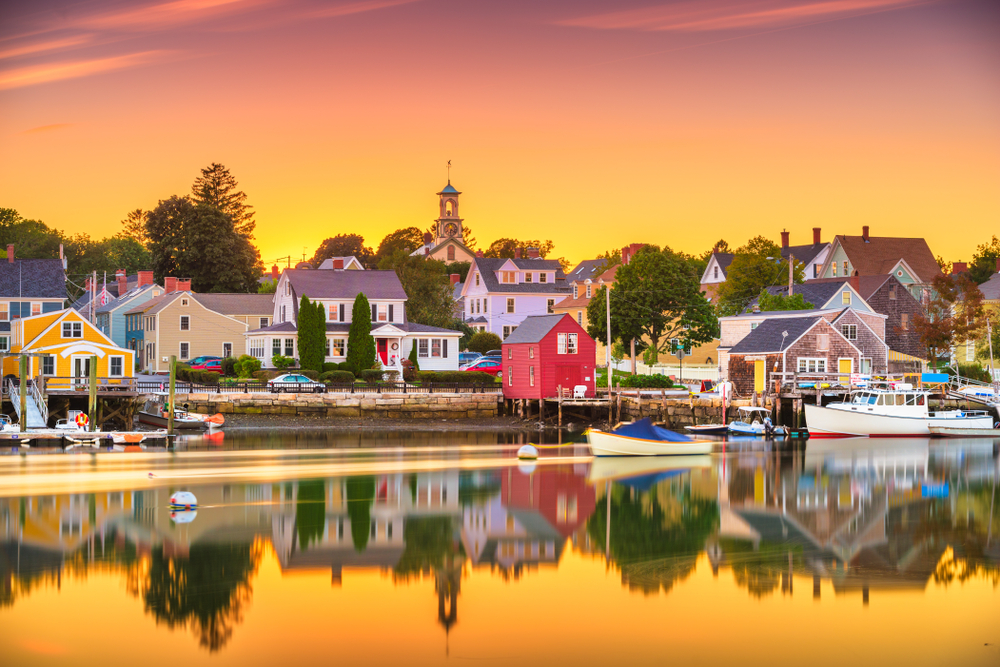 Portsmouth, New Hampshire, USA townscape at dusk. The article is about towns in New England that feel like a hallmark movie.