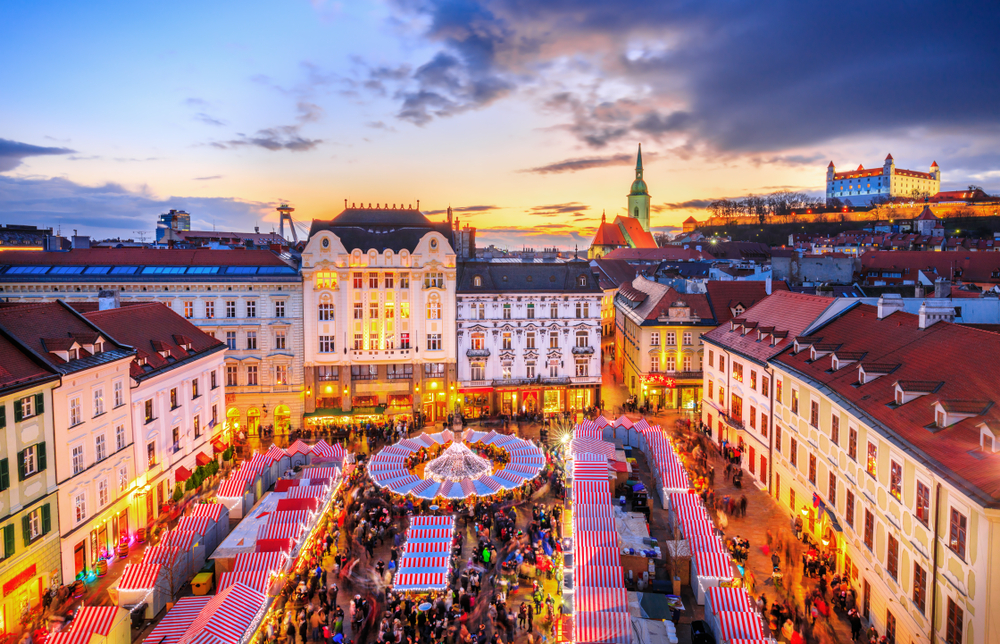 View on main square and Christmas market in historical center of Bratislava city, Slovakia. The article is about Christmas market trip to Europe.