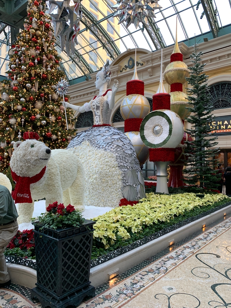 Christmas time tree display at at the Bellagio Hotel in Las Vegas with flowers making a polar bear and giant oraments
