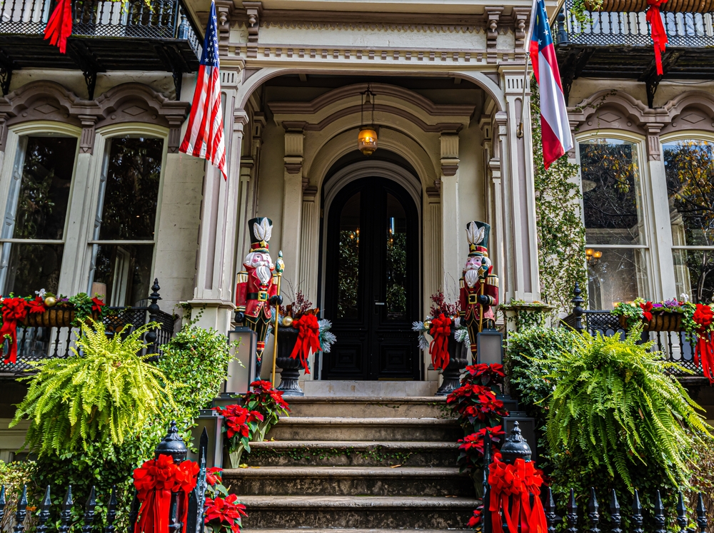 a southern home all decorated for Christmas time on the front steps