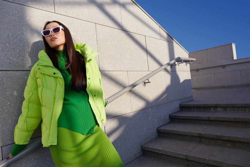 This girl knows what to wear in Italy in winter and is channeling a chrome look with all shades of grey in her green skirt, turtleneck and parka.