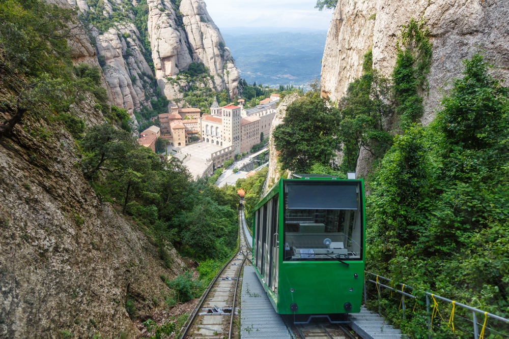 The Montserrat Abbey Monastery cable car Barcelona Spain Catalonia travel overlooking town below