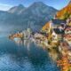 In Northern Europe, which is one place to consider when looking at iconic Europe Trips to Take in 2026, mountains are on the edge of the lake, as are homes, churches, and the trees that fade into fall covers.