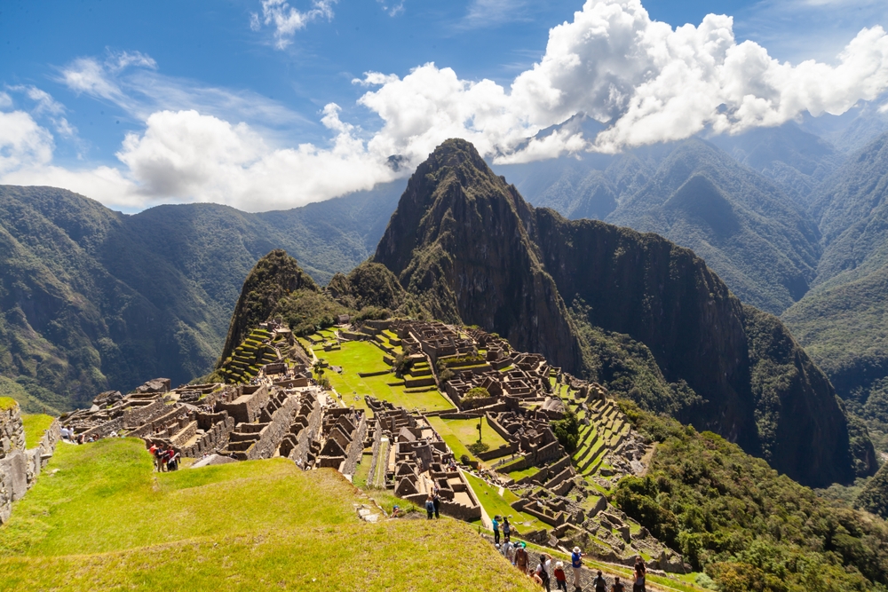 An overhead shot of Machu Picchu shows why Peru is an option for one of the iconic World Trips to Take in 2026: these stark hills are vibrantly green and peppered with ruins to explore. 